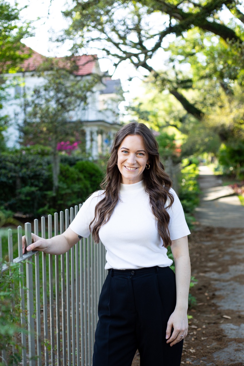 Jesse Coleman, licensed REALTOR and property manager, on an Uptown New Orleans sidewalk