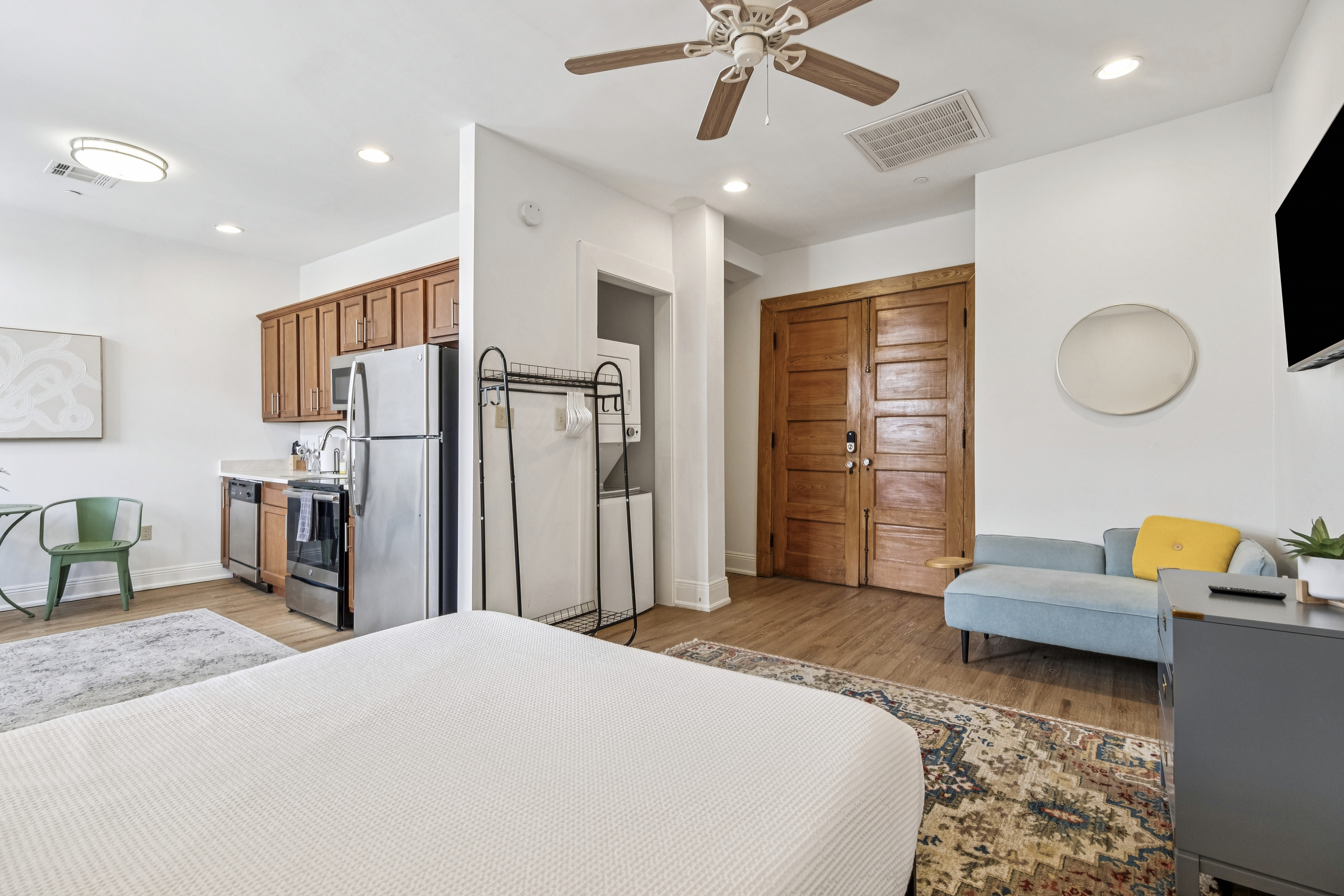 Unit 201 living area with desk and green bistro set