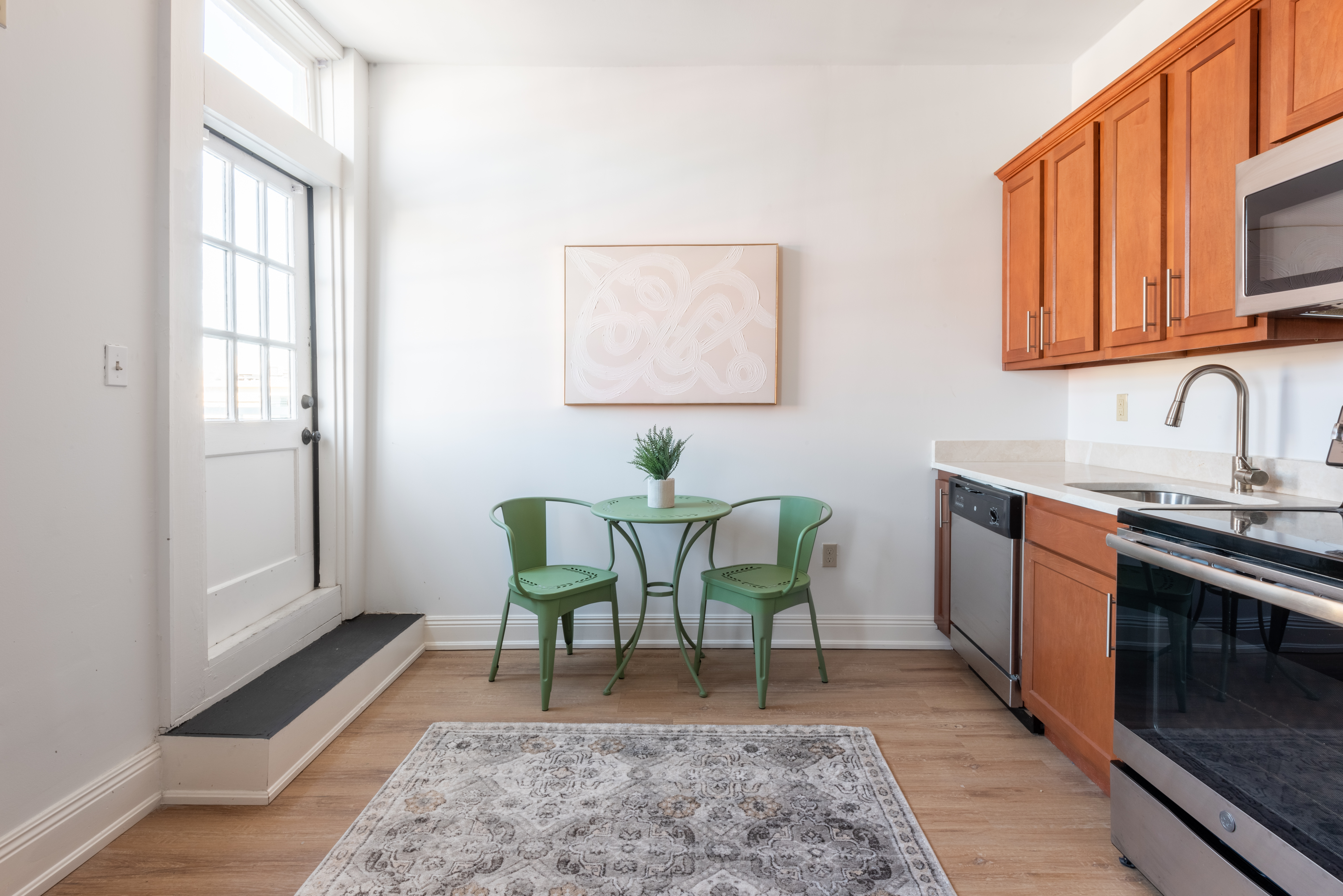 Unit 201 view toward kitchen and entry doors